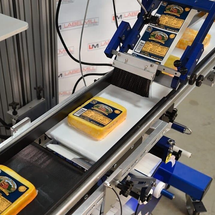 products going through a label applicator